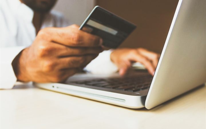 Online storefront displayed on a laptop screen with a shopping cart icon